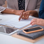 Lawyer discussing expert valuation in a family law case with client in Newcastle