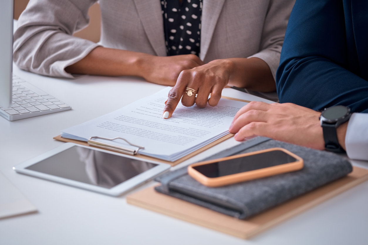 Lawyer discussing expert valuation in a family law case with client in Newcastle
