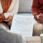 De facto couple discussing property settlement with lawyer in Newcastle