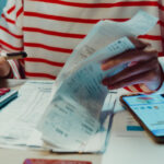 Individual preparing financial documents for property settlement in NSW