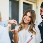 Homebuyers receiving keys after property settlement in NSW