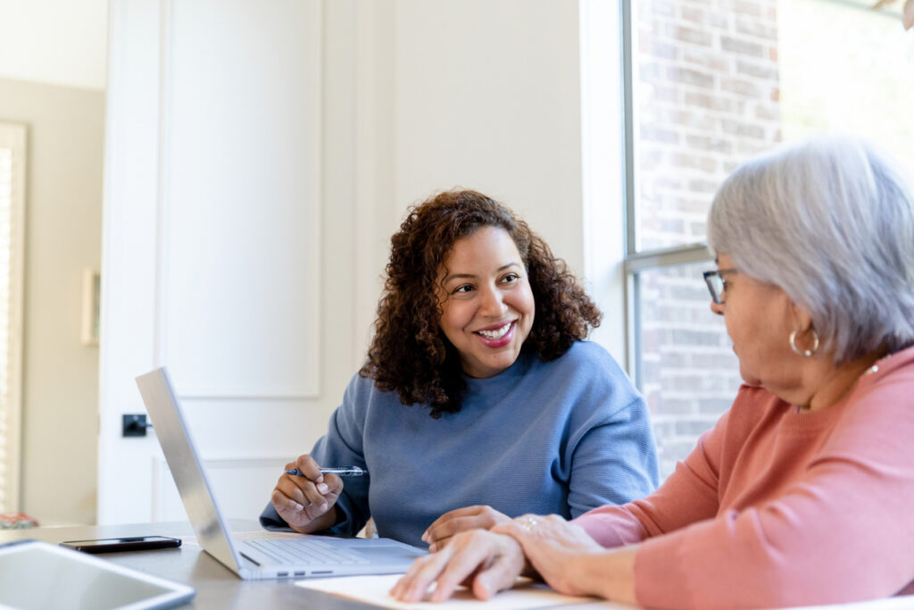 Family discussing enduring guardianship and estate planning documents with lawyer in NSW