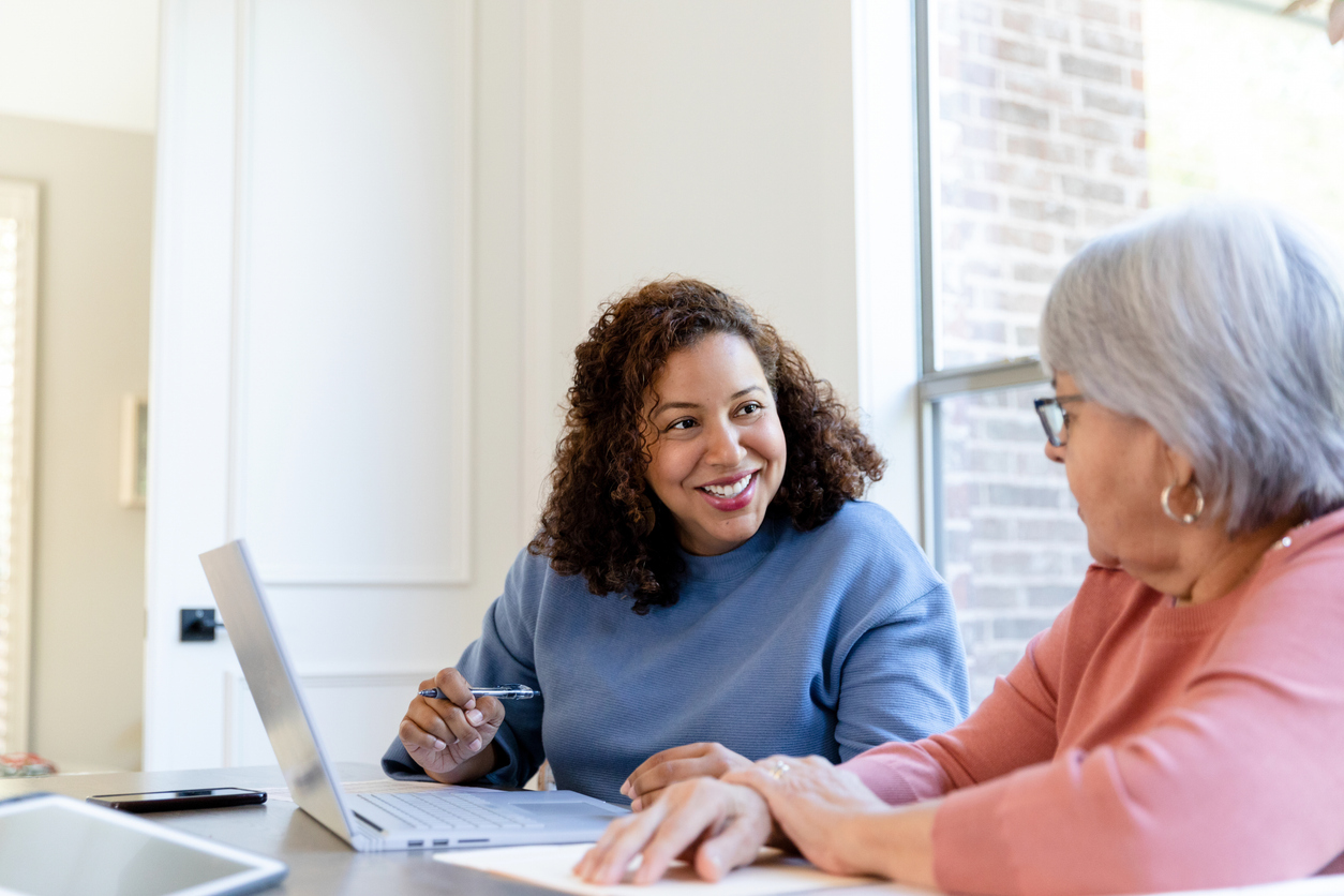 Family discussing enduring guardianship and estate planning documents with lawyer in NSW